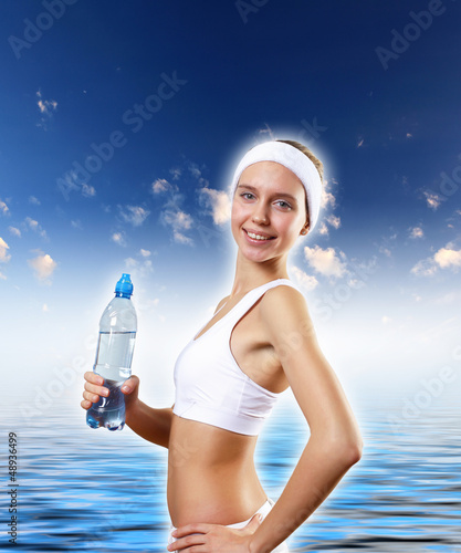 Photo: Sport woman and pure water Sport woman and pure water