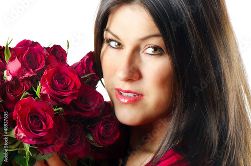 Photo: Beautiful happy woman with red roses Beautiful happy woman with red roses
