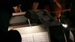 the hands of a man who conducts the orchestra