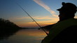 man fishes with spinning at sunset 