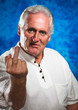 Photo: Angry man giving the middle finger Angry man giving the middle finger