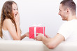 young man giving box  for his girlfriend