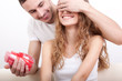man giving heart-shaped box  for his girlfriend