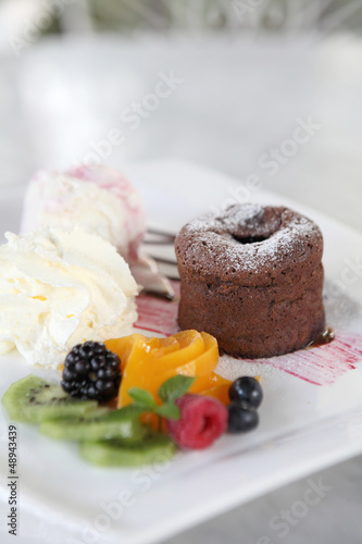 Photo: Chocolate Lava Cake with ice cream and fruit Chocolate Lava Cake with ice cream and fruit