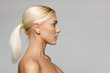 Photo: Side view closeup of beautiful blond woman looking forward Side view closeup of beautiful blond woman looking forward