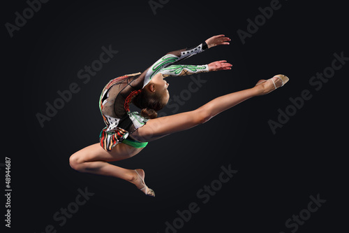 Photo: Young woman in gymnast suit posing Young woman in gymnast suit posing