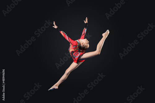Photo: Young woman in gymnast suit posing Young woman in gymnast suit posing