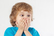 Little boy with the emotion of wonder on a white background