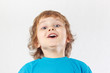 Little boy with the emotion of surprise on a white background