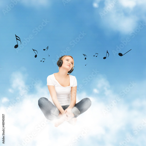 Photo: happy teenage girl in big headphones happy teenage girl in big headphones
