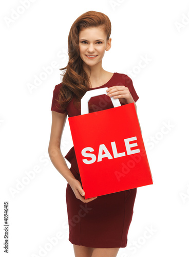 Photo: teenage girl in red dress with sale sign teenage girl in red dress with sale sign