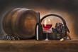 Foto: still life with red wine and old barrel still life with red wine and old barrel