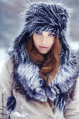 Photo: Young woman winter portrait. Shallow dof. Young woman winter portrait. Shallow dof.