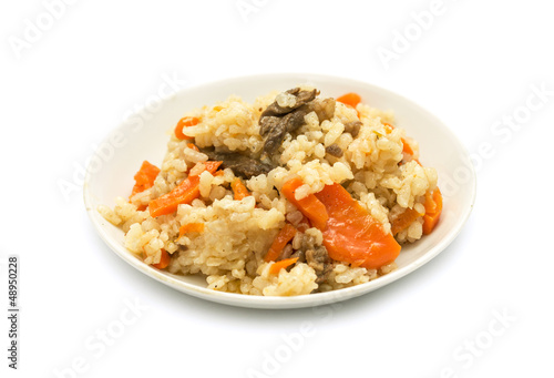 Photo: plate of pilaf on a white background plate of pilaf on a white background