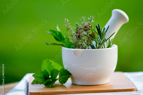 Photo: Fresh herbs in the mortar - healthy food Fresh herbs in the mortar - healthy food