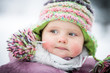 Happy baby on the winter background