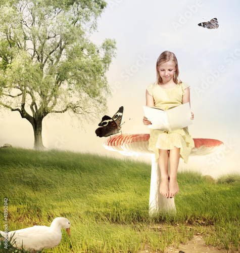 Photo: Girl Reading a Book on Mushroom Girl Reading a Book on Mushroom