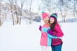 Two young girl friends in winter outdoors. Holidays. Happy Teens