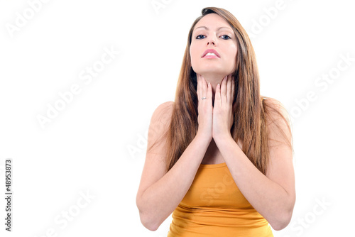 Photo: Pretty young woman sore throat isolated on white background Pretty young woman sore throat isolated on white background