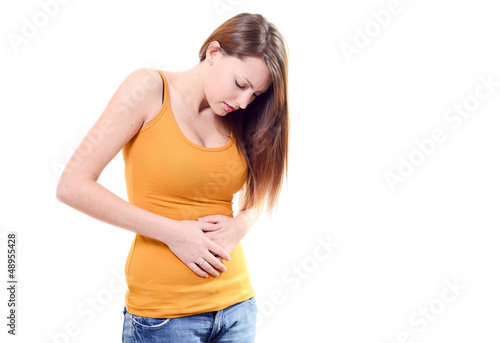 Photo: beautiful young woman stomachache on white background beautiful young woman stomachache on white background