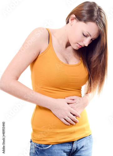 Photo: beautiful young woman stomachache on white background beautiful young woman stomachache on white background