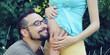 Photo: Future dad listening the belly of his pregnant wife. Future dad listening the belly of his pregnant wife.