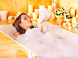 Woman relaxing at  bubble bath.