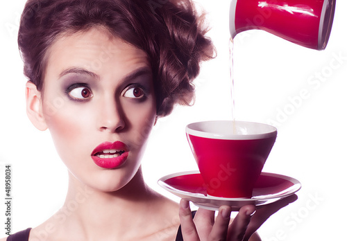 Photo: young woman with fashion makeup and tea cup young woman with fashion makeup and tea cup