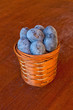 Plum on table and a punnet