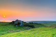 Irish cottage house at sunset