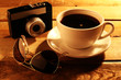 Coffee cup with retro photocamera