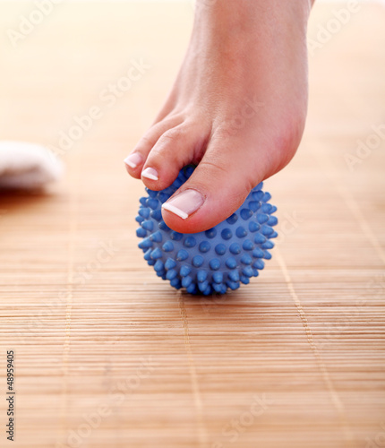 Photo: Beautiful foot with massage ball Beautiful foot with massage ball