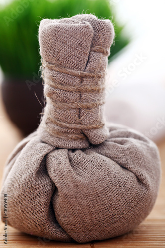 Photo: Image of masage sachet near grass Image of masage sachet near grass