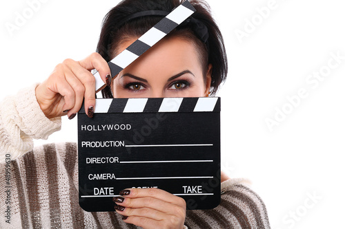 Photo: Young happy woman holding a clapboard Young happy woman holding a clapboard