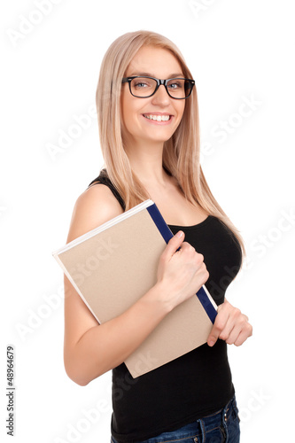 Photo: Student holding books Student holding books