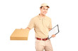 A delivery person delivering a packet and holding a clipboard