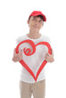 Photo: Daydreaming boy holding red love heart Daydreaming boy holding red love heart