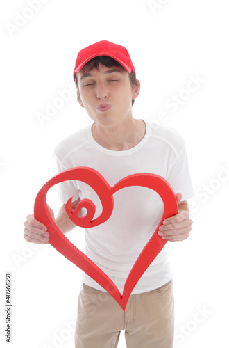 Photo: Teen boy red heart puckering up kissing Teen boy red heart puckering up kissing