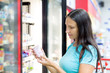 Woman buys yogurt