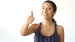 Young woman giving thumbs up