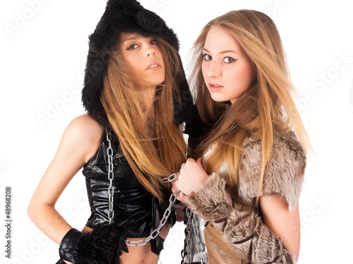 Photo: Two girl in barbarian and cat costumes Two girl in barbarian and cat costumes