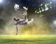 football player striking the ball