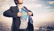 Businessman showing superman suit underneath shirt