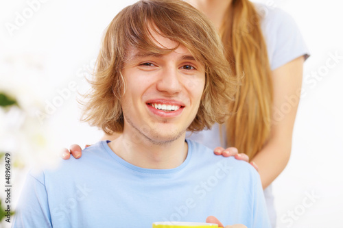 Photo: Young happy man drinking tea Young happy man drinking tea