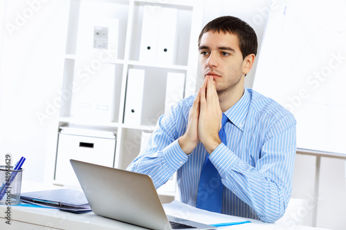 Photo: Young businessman in the office Young businessman in the office