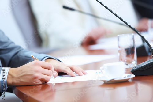Photo: Hands of businessman writing Hands of businessman writing