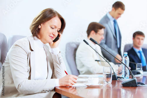 Photo: Four businesspeople at meeting Four businesspeople at meeting