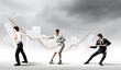 Three business people pulling rope