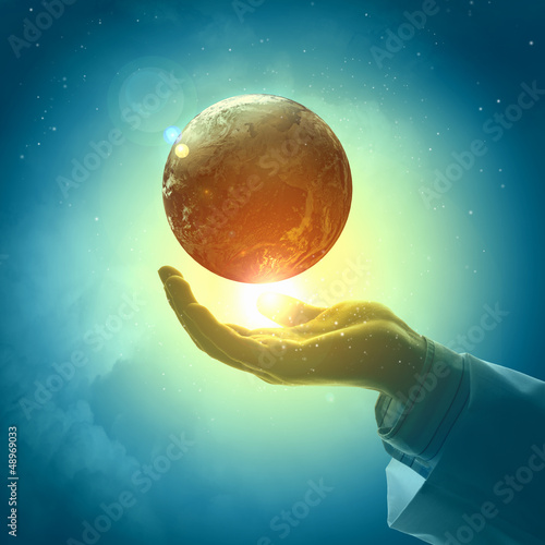 Photo: Image of earth planet on hand Image of earth planet on hand