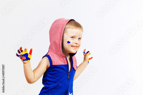 Photo: happy child with paint on the hands happy child with paint on the hands